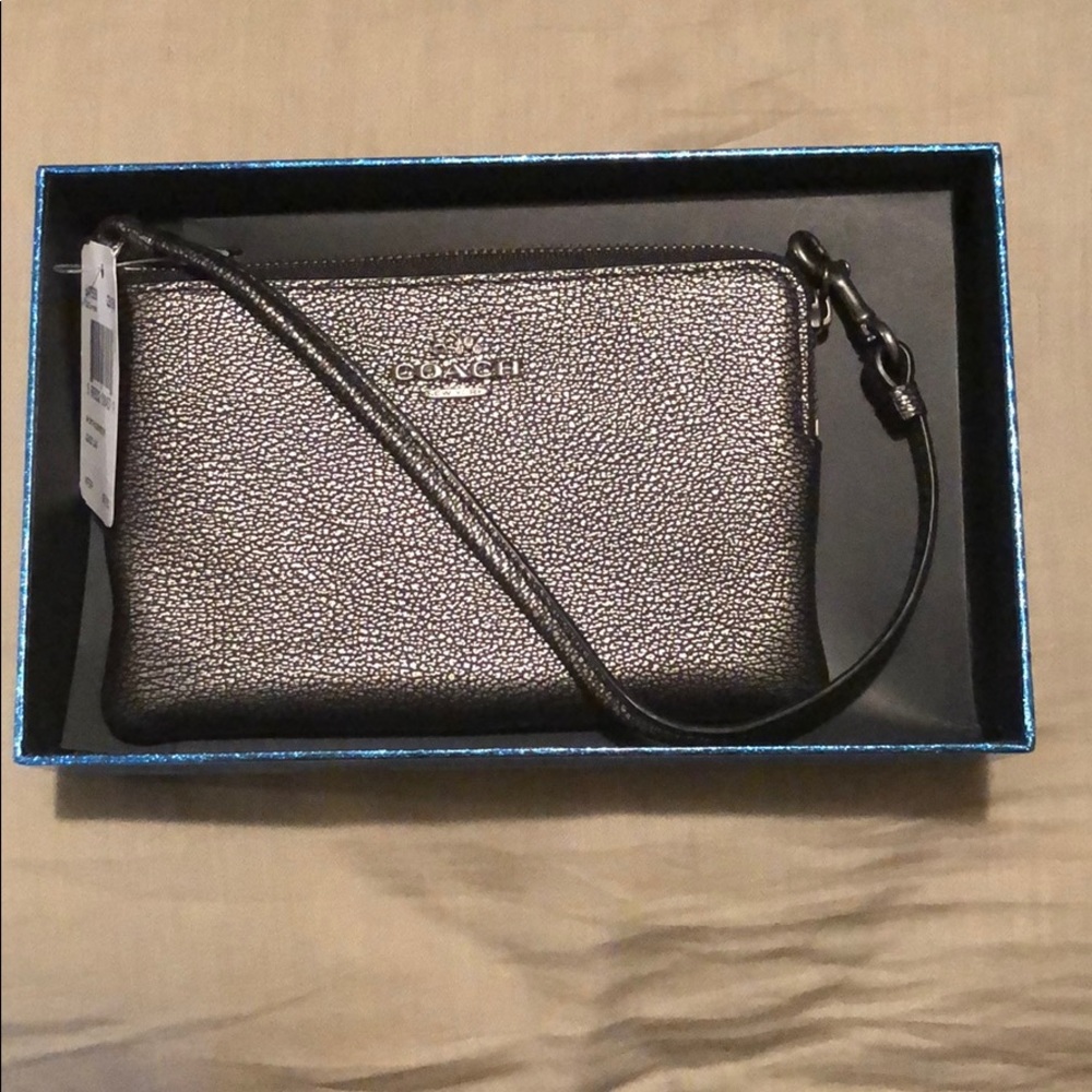 Brand new gunmetal colored Coach wristlet
